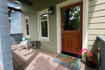 Cute and colorful front porch with seating area